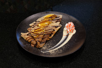 Pancakes on a black background