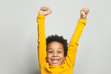 Happy African American child boy having fun on white background