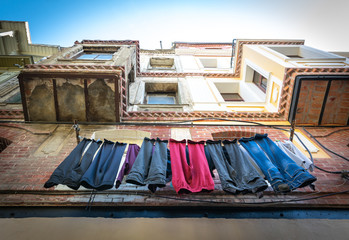 Clothes hanging outside and drying in the street of Balat. Turkish culure and living in historical places. istanbul.Turkey.