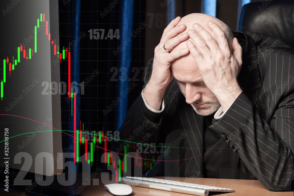 Poster a man clutched his head against the backdrop of falling stock prices. receiving losses on the exchan