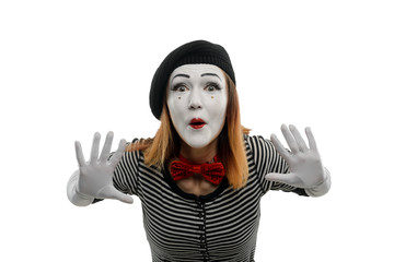 Female mime pushing invisible object forward. Woman is performing a pantomime