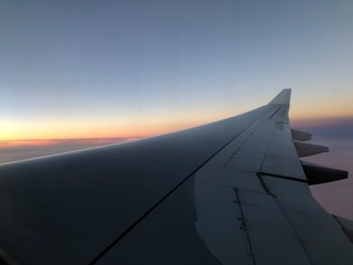 Fototapeta na wymiar Aircraft wing at sunset
