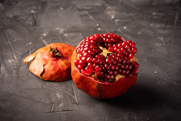 Fresh pomegranate on dark surface