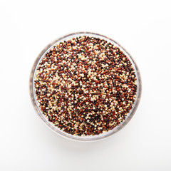 Portion of quinoa seeds mix on white background