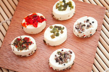 cream cheese served in the shape of boats sprinkled with spices