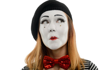 Curious woman looking at something. Close up portrait of female mime artist