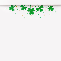 Happy St. Patricks Day minimal background. Green glitter shamrocks border on white background