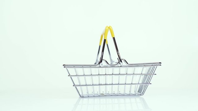 empty supermarket basket rotates on a white background 4k