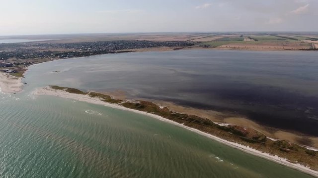 Aerial shot of a bandy sand stripe at the Black Sea shoal on a sunny day in summer 