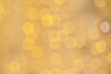Golden bokeh abstract texture. Colorful defocused background with blurred bright light glitter