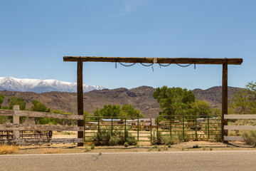 Camping behind a wooden gate, Benton, California, USA.