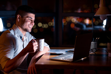 Business Guy At Laptop Having Coffee Sitting At Workplace