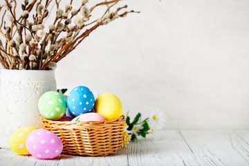 Happy Easter. Congratulatory easter background. Easter eggs and flowers. Background with copy...