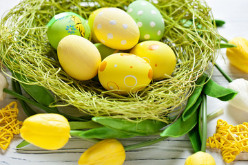 Happy Easter. Congratulatory easter background. Easter eggs and flowers. Background with copy...