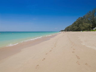 view of white sand beach with blue-green sea and blue sky background, Phra Ae Beach, Ko Lanta island, Mu Ko Lanta National Park, Krabi, southern of Thailand.