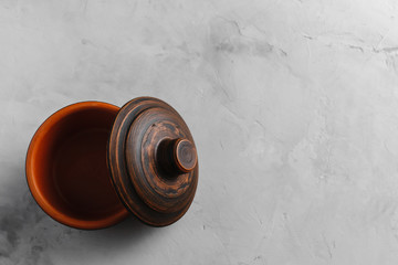 Clay pot on a light concrete background on top