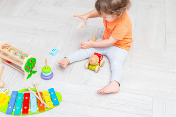 Kids play with wooden ecological baby toys. Zero waste. Life style. Education concept