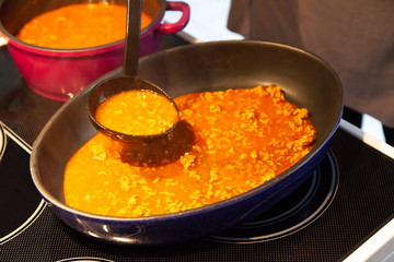 prepare lasagne in the kitchen with fresh ingredients and meat and lasface plates