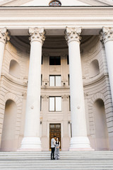 Expectant parents, a young family expecting their first child walking around the city