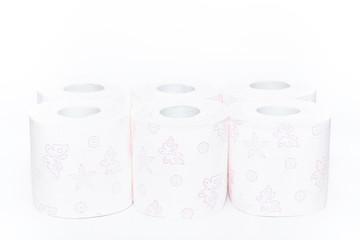 White toilet paper rolles with purple shapes, angle photo
