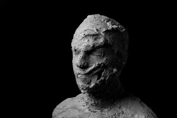 dramatic black and white portrait, shapeless face formed from torn pieces of clay