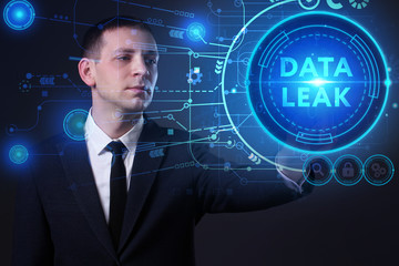 Business, Technology, Internet and network concept. Young businessman working on a virtual screen of the future and sees the inscription: Data leak