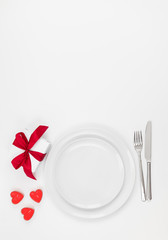 Valentines day or romantic dinner background. Festive romantic table setting on a white background. Valentine's card.