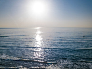 Obraz premium Aerial view of sunset over the sea photos taken by the drone