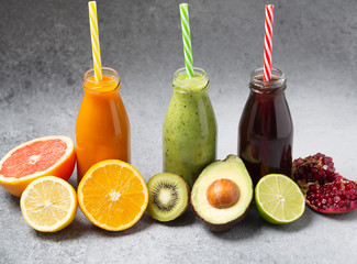 Various freshly squeezed fruits and vegetables juices. Vegetables and fruit smoothie in bottle, selective focus. 