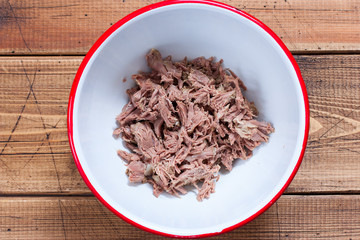 Step-by-step preparation of salad with boiled beef and egg pancakes, step 1 - slicing boiled beef, top view, horizontal