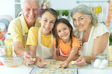 Portrait of family l baking together in the kitchen