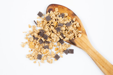 Wooden spoon with cereals on white background