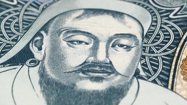 Genghis Khan portrait on Mongolia tugrik banknote rotating. Low angle, macro. 4K, 422 10 bit