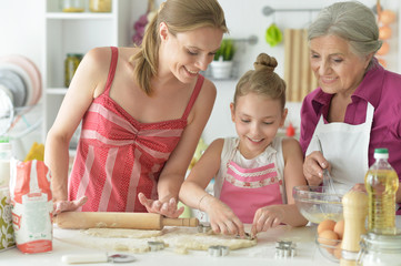 Close up portrait of beautiful women and child baking