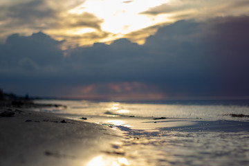 Sea ocean landscape at sunset with volumetric light (god rays) Baltic shore coast at dusk