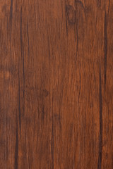 Seamless dark brown wooden board texture background with vignette