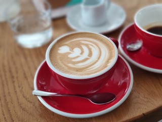 cup of coffee on wooden table