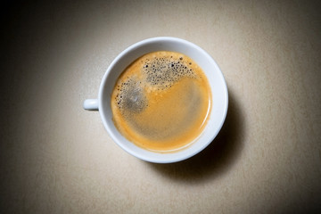 Top view of perfect espresso shot with vignette