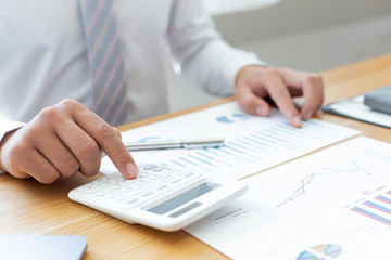 Businessmen use graphs to summarize results and calculate income-expenses to find financial balance points and use them to improve and advance business, finance and economic concepts.