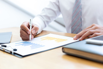 Businessmen use graphs to summarize results and calculate income-expenses to find financial balance points and use them to improve and advance business, finance and economic concepts.