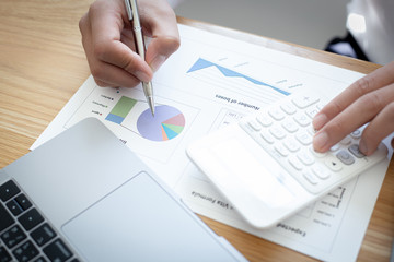 Businessmen use graphs to summarize results and calculate income-expenses to find financial balance points and use them to improve and advance business, finance and economic concepts.