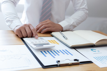 Businessmen use graphs to summarize results and calculate income-expenses to find financial balance points and use them to improve and advance business, finance and economic concepts.