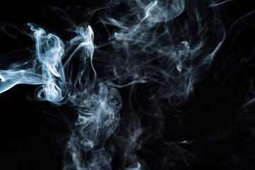 Photo of a wisp of smoke on a dark background