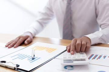 Businessmen use graphs to summarize results and calculate income-expenses to find financial balance points and use them to improve and advance business, finance and economic concepts.