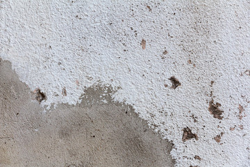 Old concrete wall with white paint