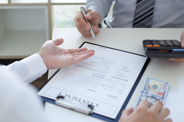  Businessmen make dollar payments while signing an investment agreement to be a partner in an illegal and successful manner, Bribery and corruption concept..