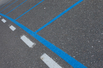  car park area with blue line for ticketing