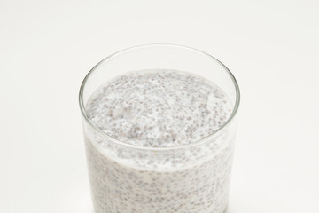 Chia pudding  in glass on a white background. Space for text or design.