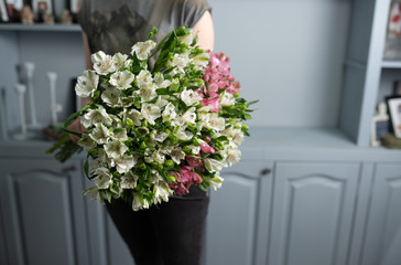 Large beautiful bouquet of mixed flowers in woman hand. Floral shop concept . Handsome fresh bouquet. Flowers delivery.