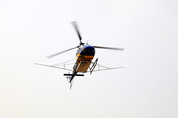 Agricultural helicopters fly in the air
